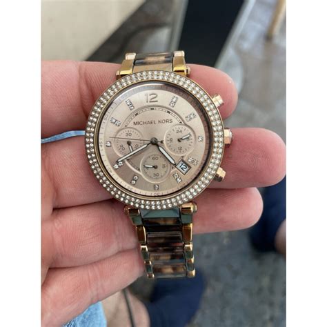 michael kors wie mache ich die uhr an|Bedienungsanleitung für Michael Kors Armbanduhren .